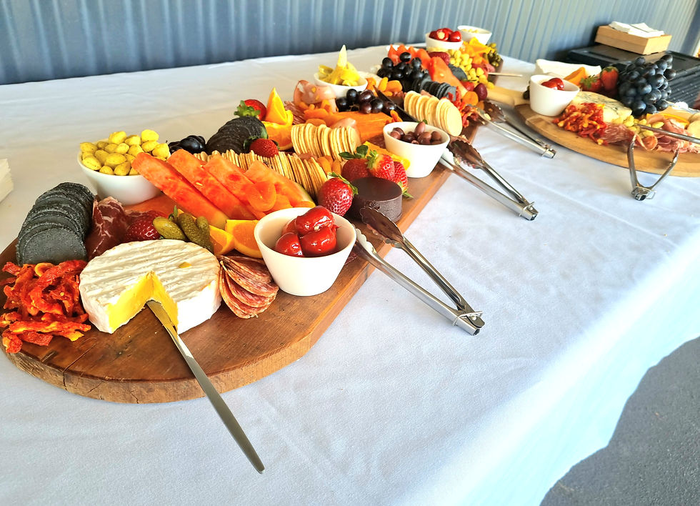 Grazing table with cured meats, cheeses, pickled vegetables, fruit, crackers and crispbreads — entirely gluten-free